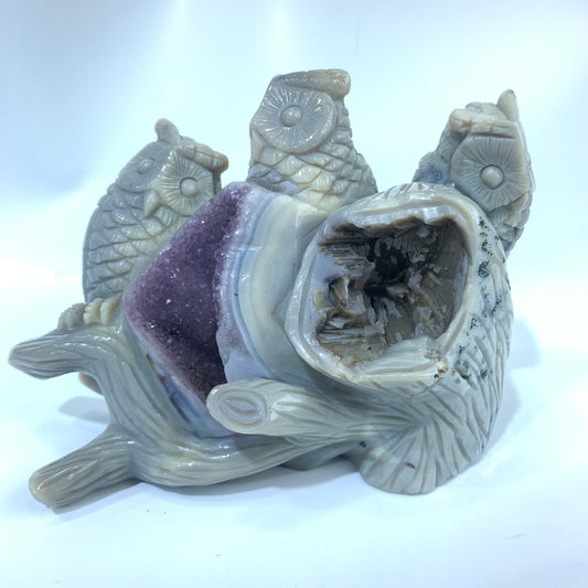 Amethyst cave carved with three owls